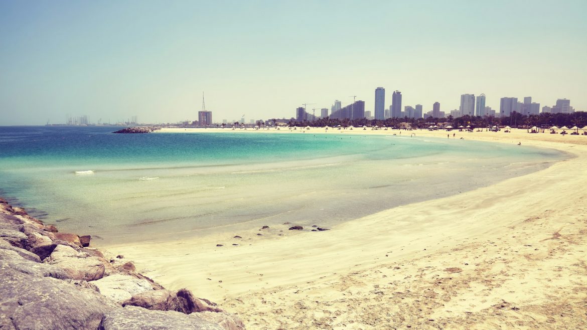 Al Mamzar Beach in Dubai, Sharjah city in distance, UAE.